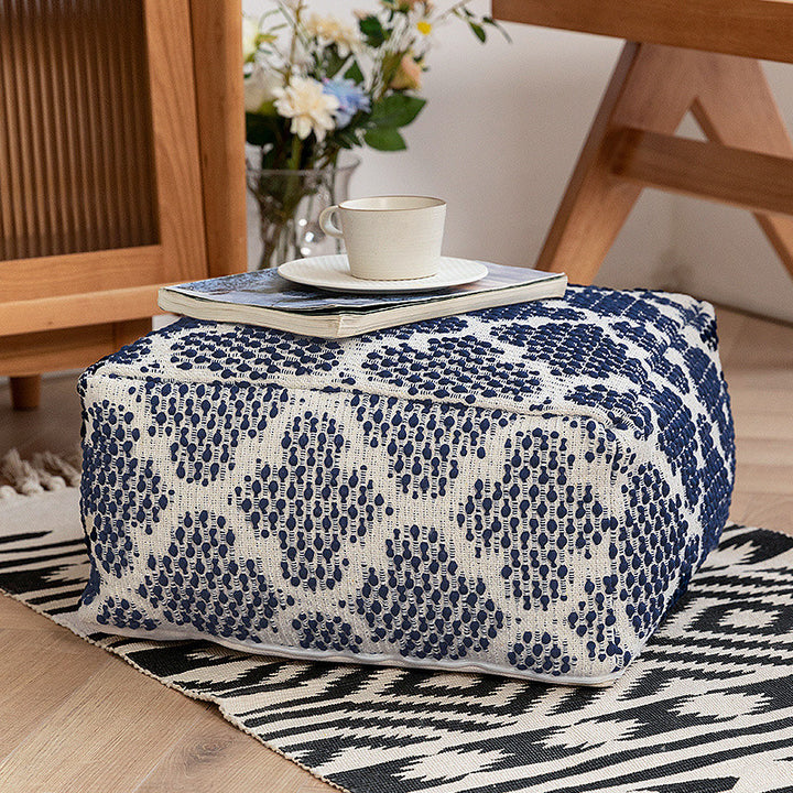 Woven decorative pouf with fringes and structured striped look