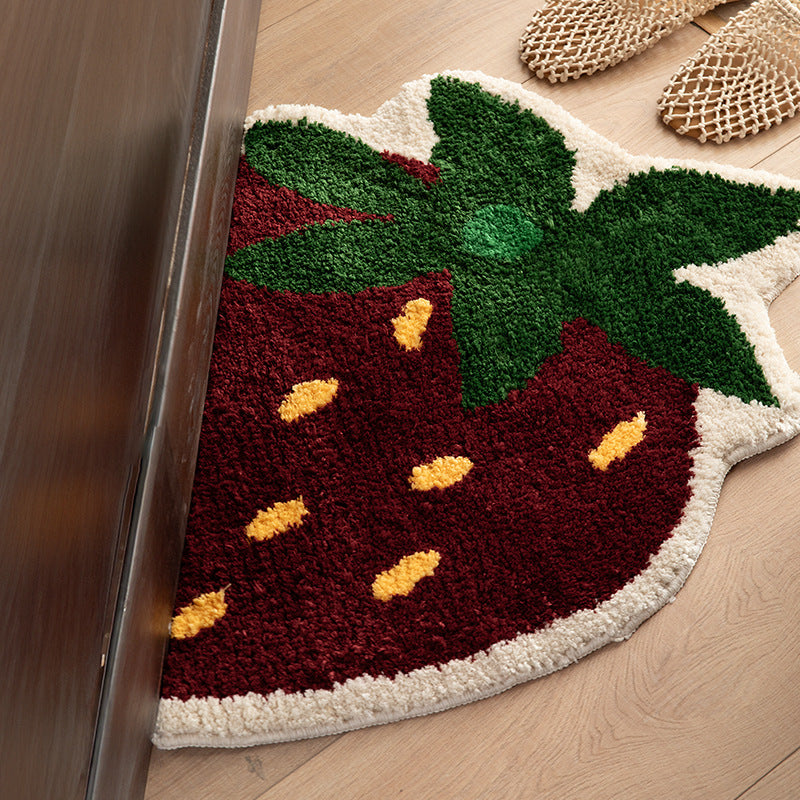 Playful hand-tufted strawberry mat made of dense cotton blend