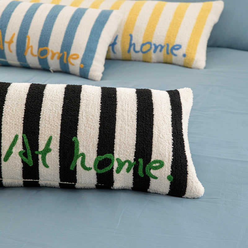 Elongated bench and windowsill cushion with nautical stripe texture and embroidered lettering