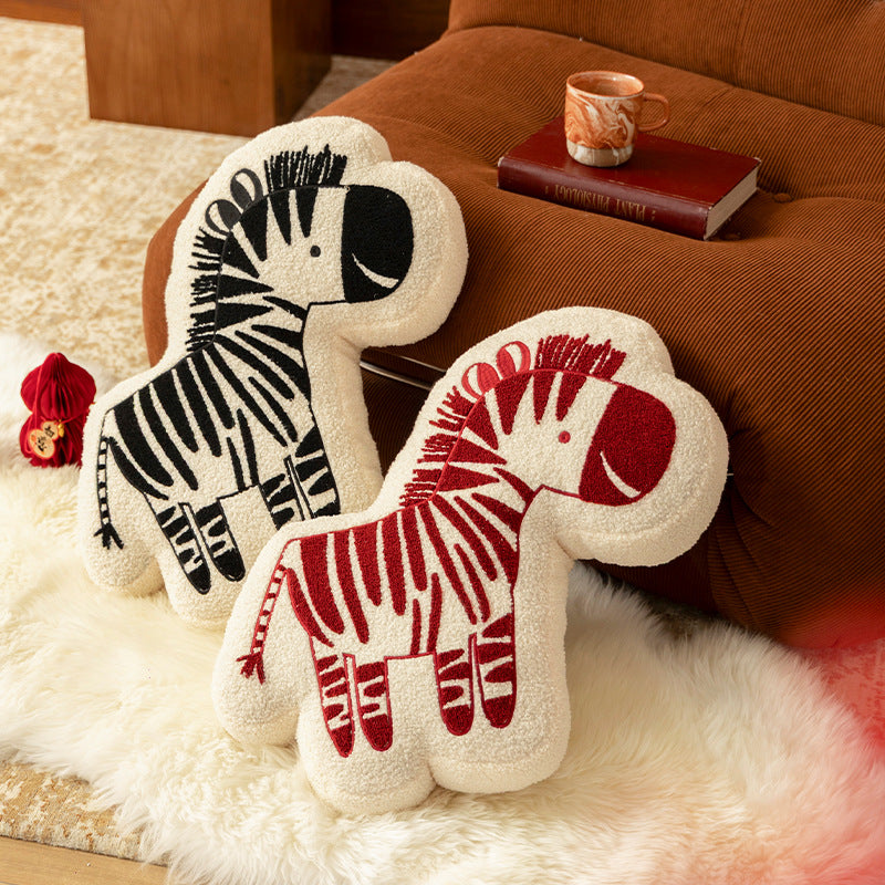 Shaped children's room decorative pillow made of teddy fleece with embroidered zebra motif and contoured silhouette