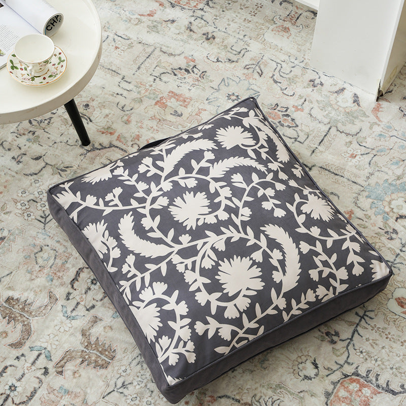 Padded chair cushion with carrying handle and decorative stitching