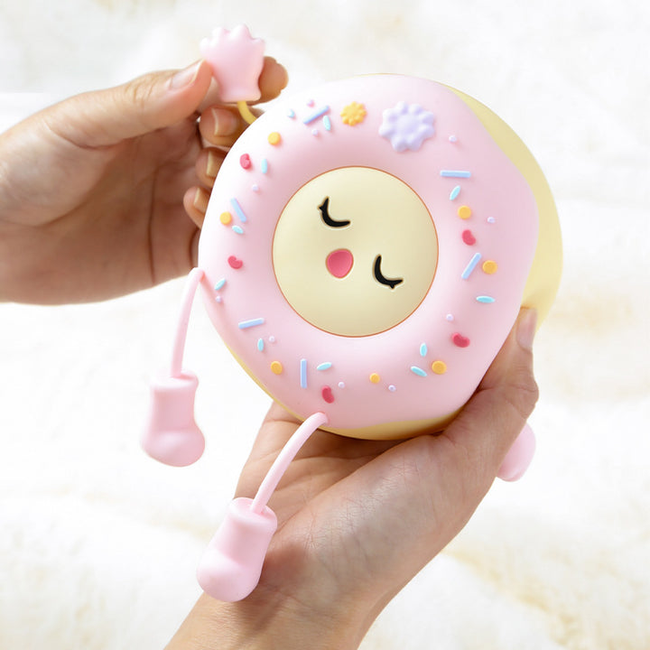 Whimsical silicone-shaped LED night light in donut form with flexible limbs