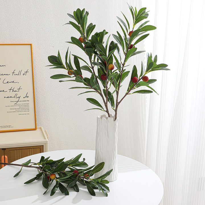 Artificial branch with decorative fruits