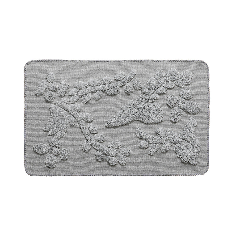 Luxurious organic cotton bath mat with relief pile structure