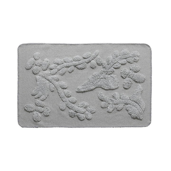 Luxurious organic cotton bath mat with relief pile structure