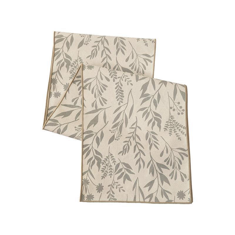 Woven table runner and placemat set made of cotton-linen with botanical scrolling pattern