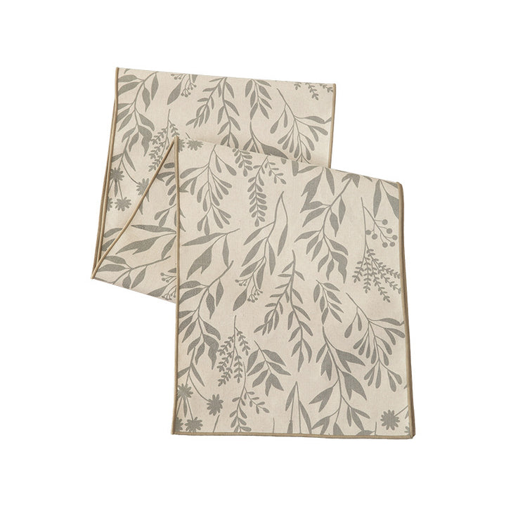 Woven table runner and placemat set made of cotton-linen with botanical scrolling pattern