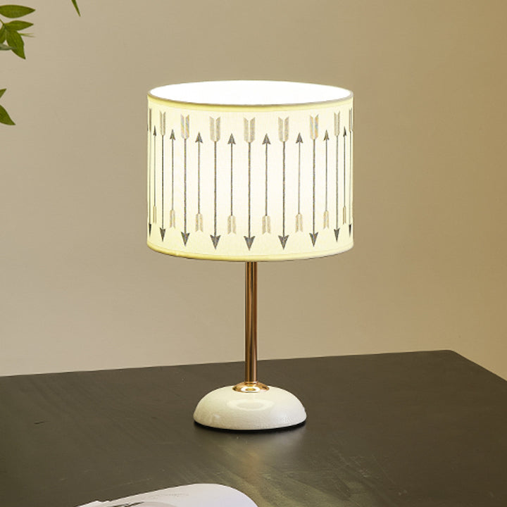 Ceramic base bedside lamp with fabric shade in arrow pattern