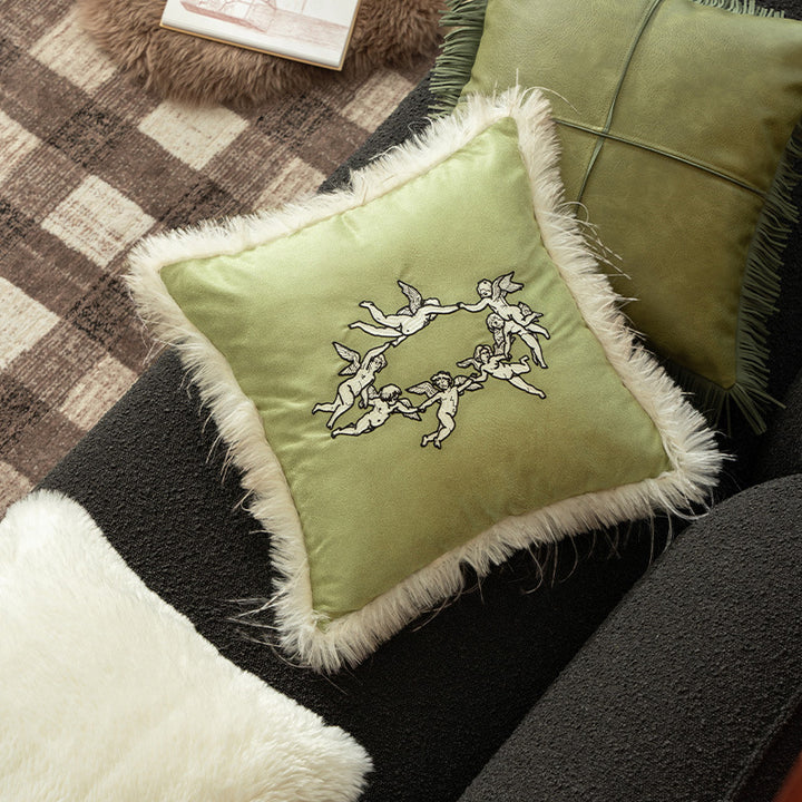 Luxurious decorative velvet cushion with angel embroidery and faux fur trim