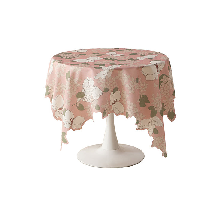 Round wipeable tablecloth with floral cut-out hem