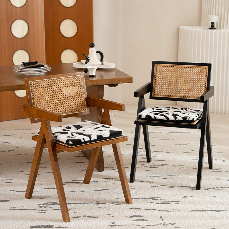 Padded seat cushion with hand-tufted leaf pattern and fastening ties