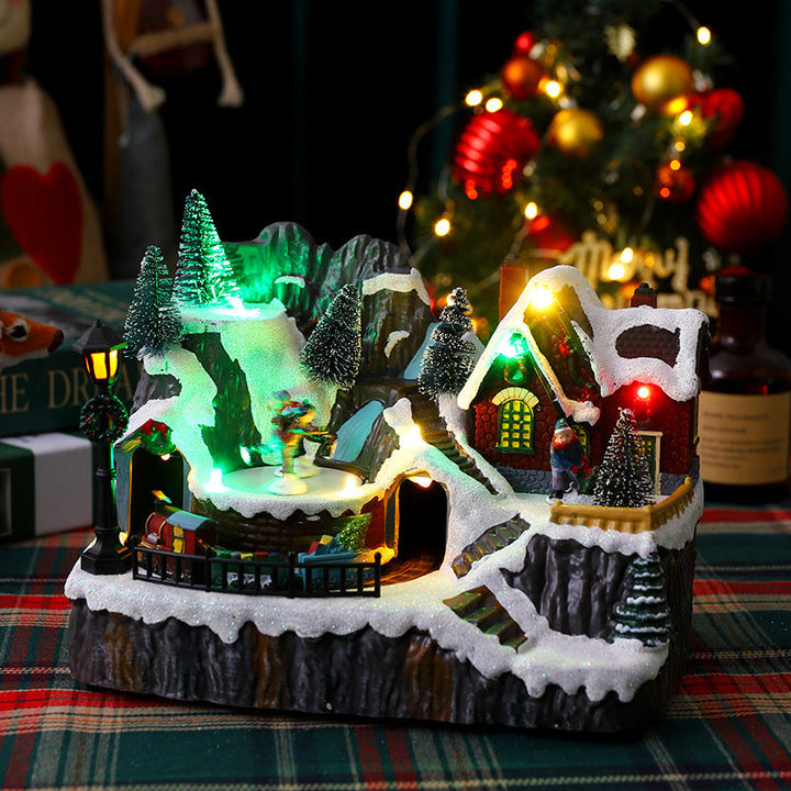 Illuminated Christmas village decoration with moving figures