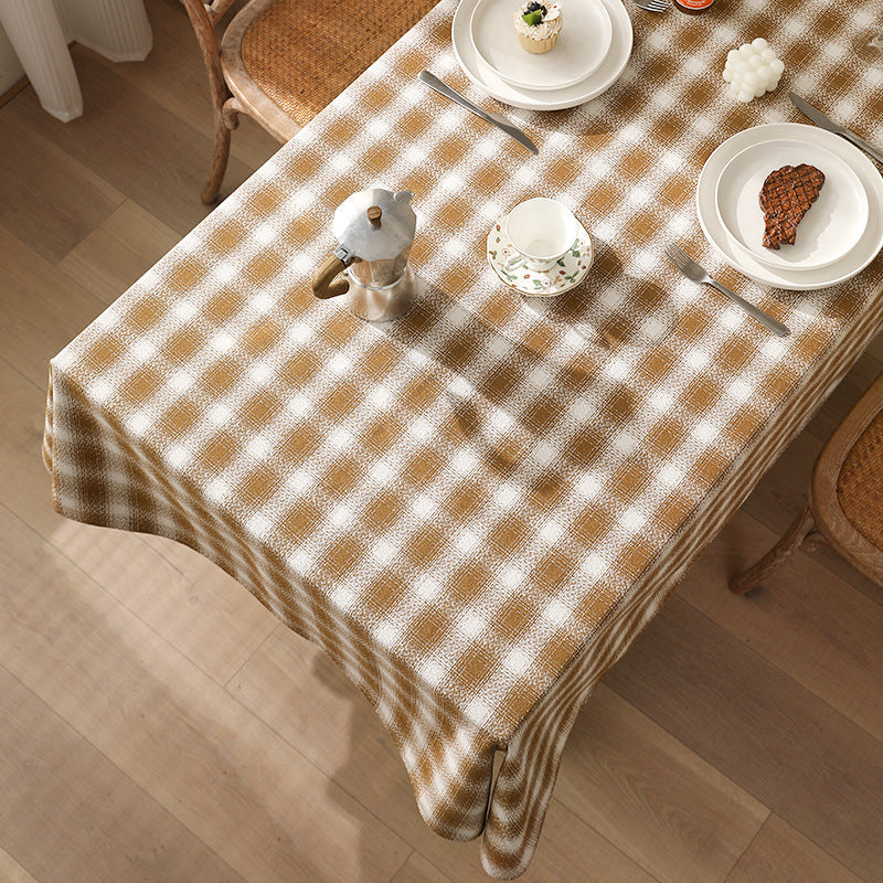 Rectangular checked tablecloth made of cotton blend with pom-pom corners