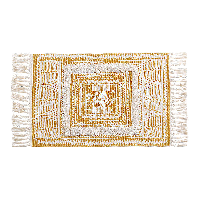 Flat Boho runner rug made of cotton blend fabric with geometric hexagon tufting and decorative fringed edge.