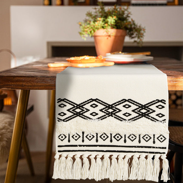 Boho table runner made of cotton blend with woven ethnic jacquard and decorative fringes