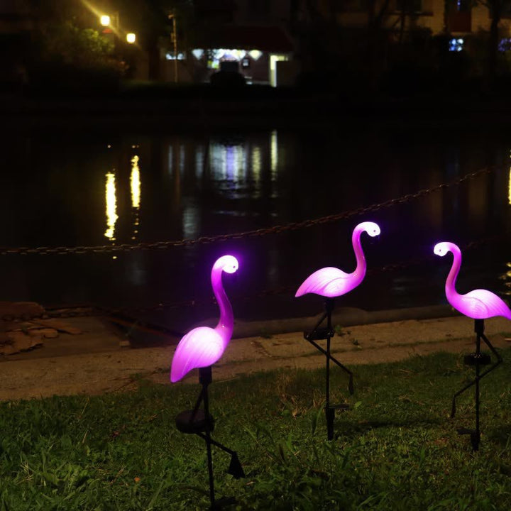 Decorative solar-powered flamingo garden stake with adjustable tray and spike attachment