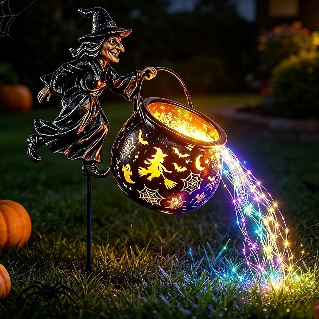 Garden decoration with illuminated witch figure