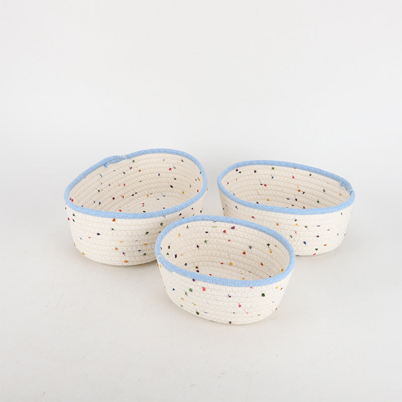 Storage basket made of natural cotton fabric with colorful dots