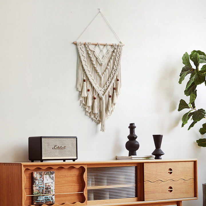 Hand-woven macrame wall hanging with decorative tassels
