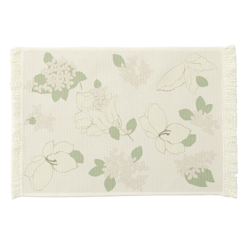 Floral woven bath mat with decorative fringes