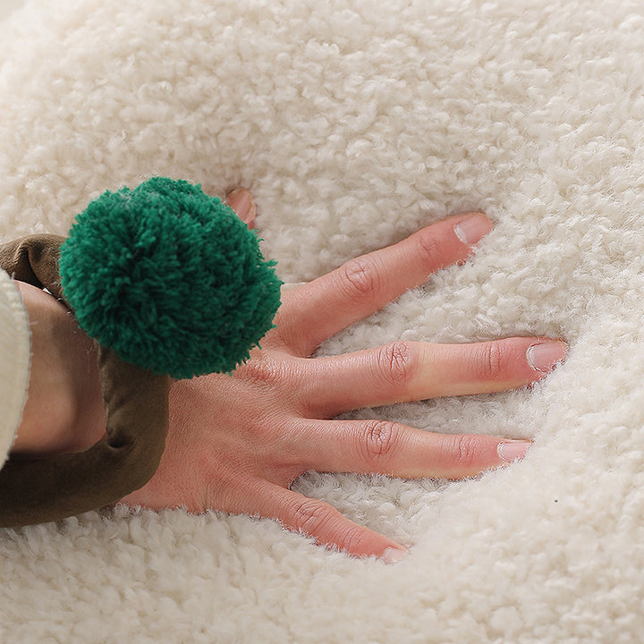 Cozy hand-shaped plush pillow with pompom ring