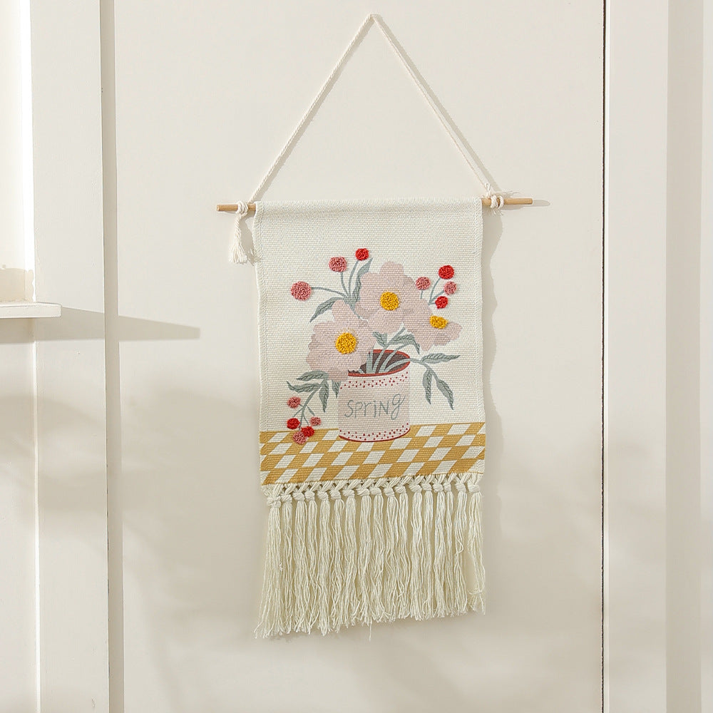 Woven cotton wall hanging with punch needle flower relief and fringes