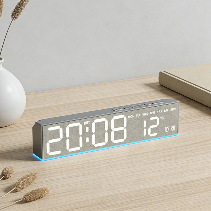 Digital alarm clock with temperature sensor and week display
