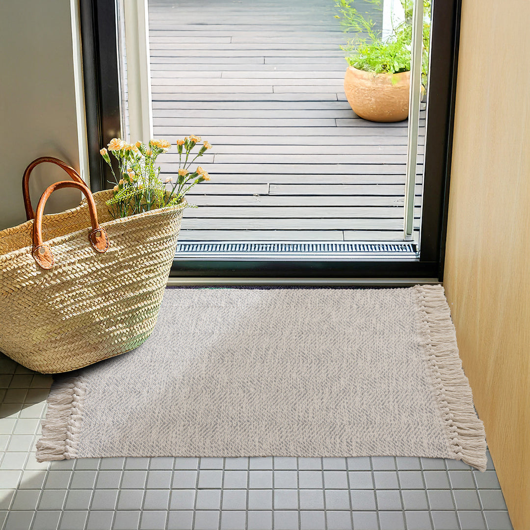 Handwoven runner rug with chevron weave and long fringes