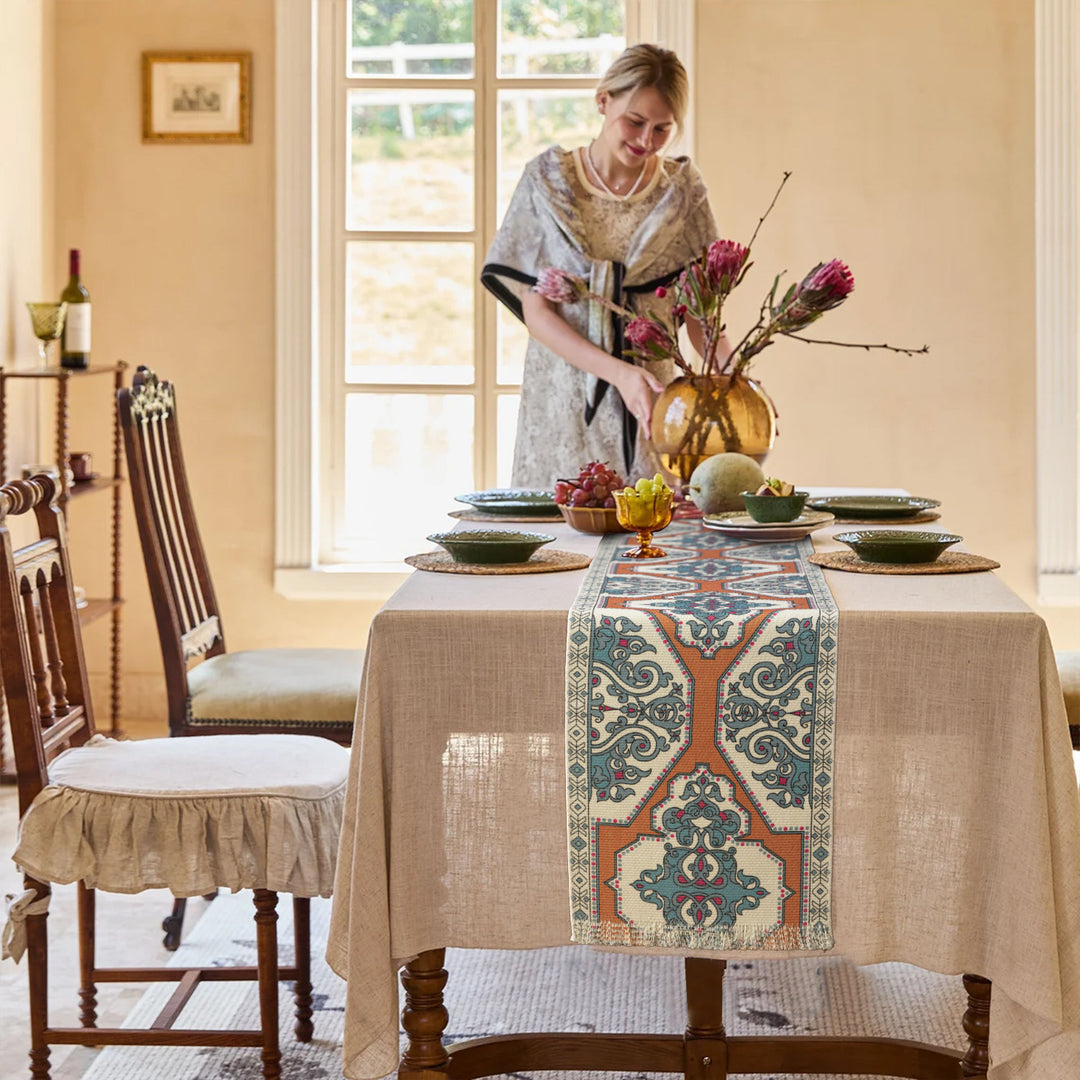 Woven table runner made of cotton blend with oriental medallion pattern and fringes