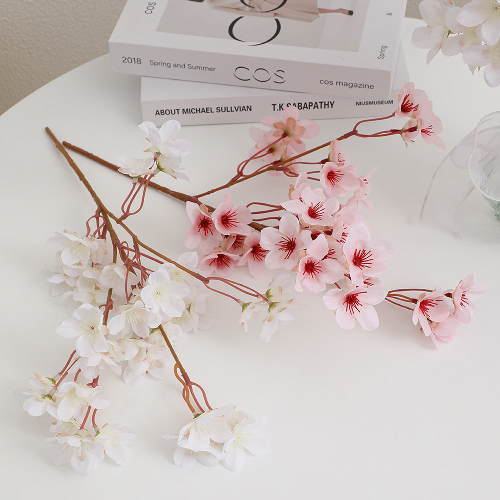 Artificial cherry blossom branch with detail-loving flowers