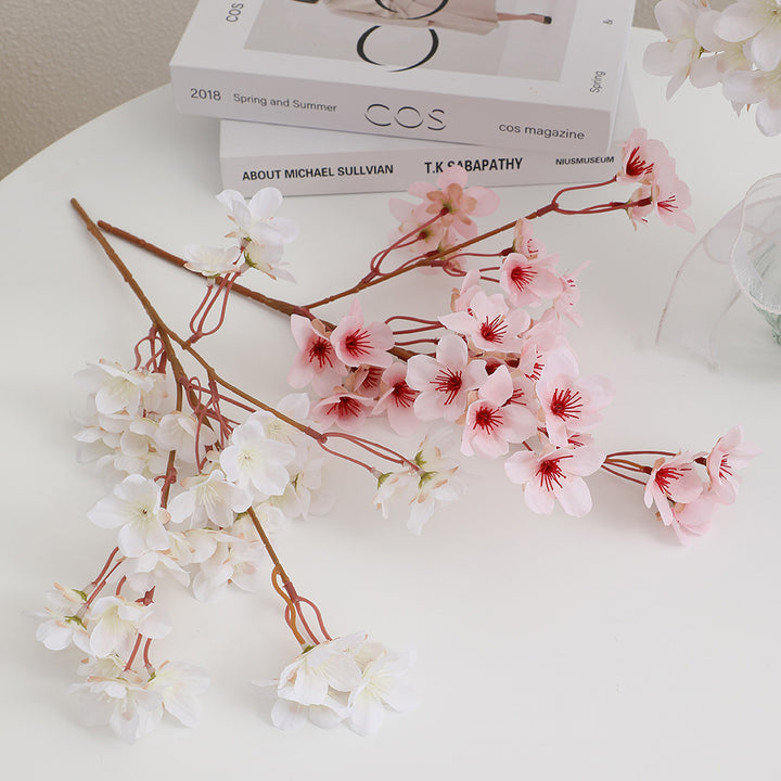 Artificial cherry blossom branch with detail-loving flowers