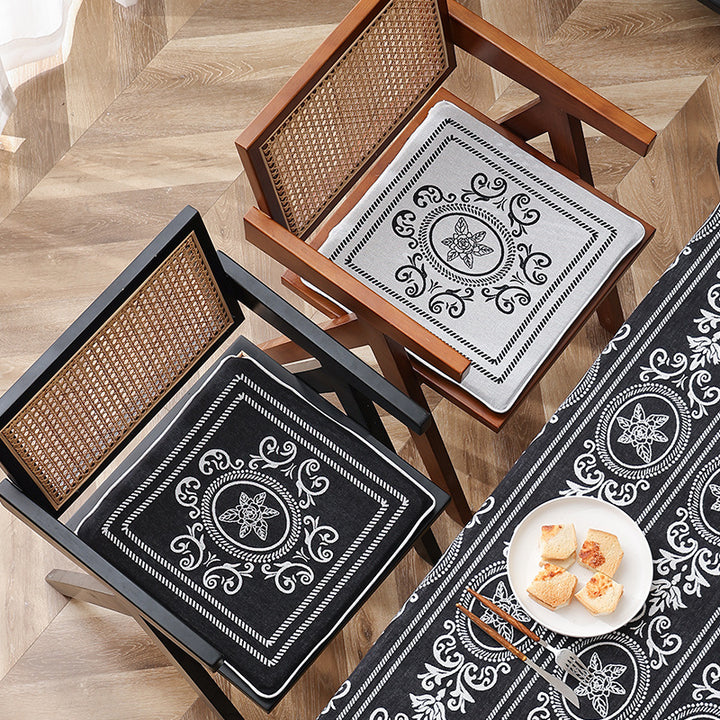 Double-sided seat cushion with ties and decorative jacquard pattern