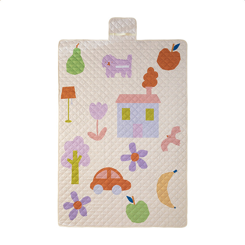 Padded outdoor picnic blanket with quilting, carrying flap and lightweight water-repellent cover