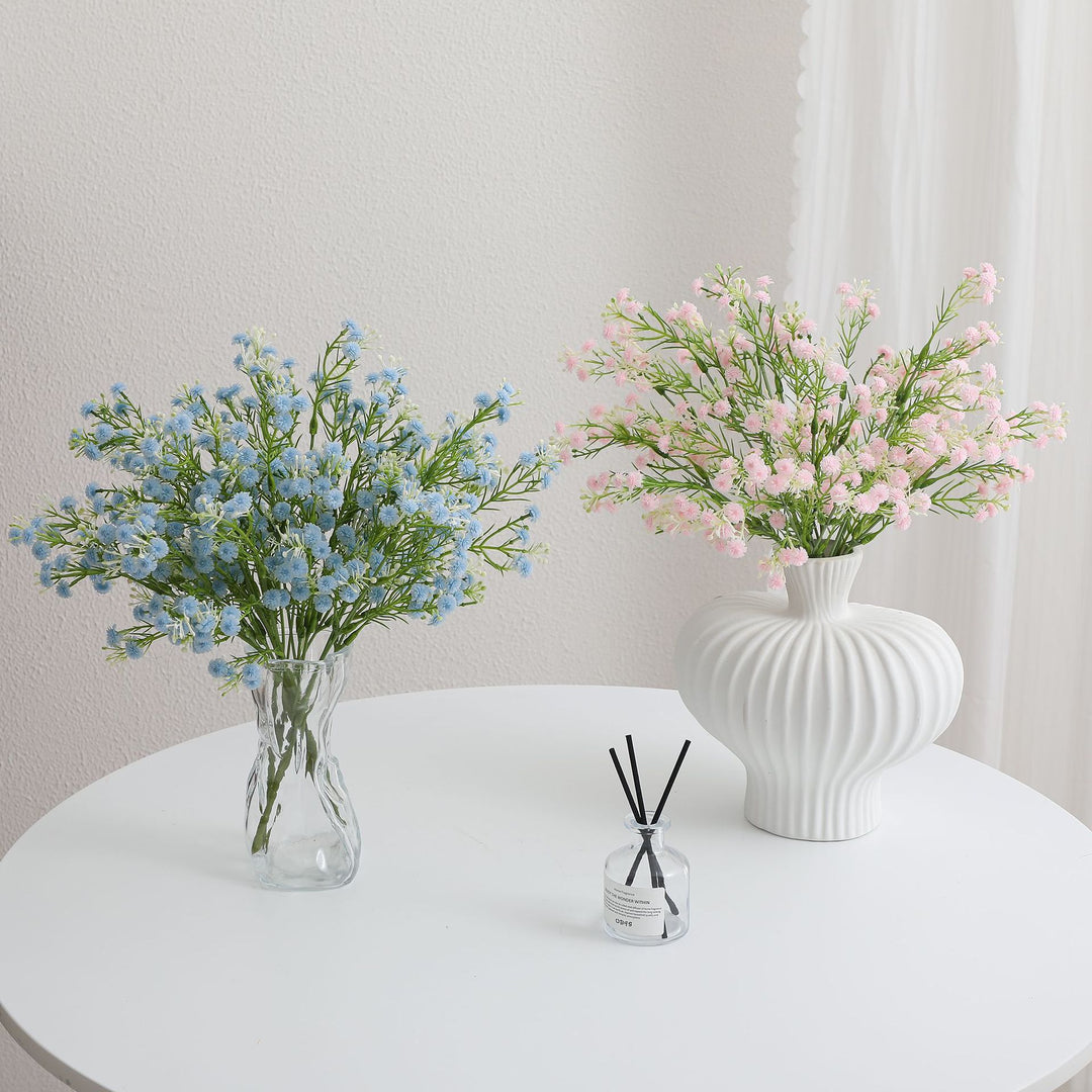 Decorative artificial flower branch with delicate purple flowers