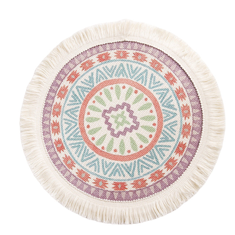 Round flat-woven cotton rug with mandala design and decorative fringes