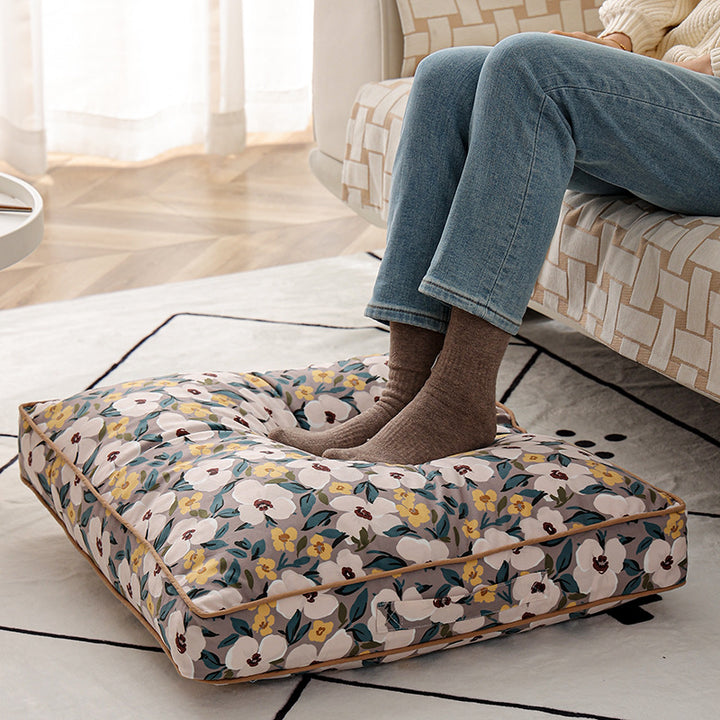 Large square floor cushion with floral cotton cover, piping, and carrying handle