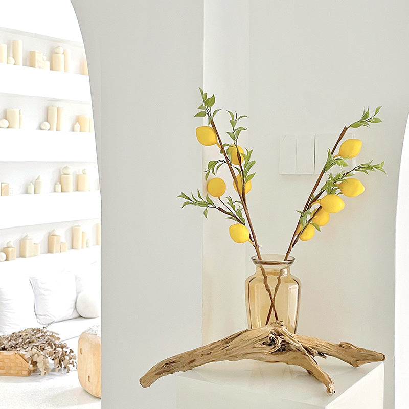 Decorative branch with artificial lemons