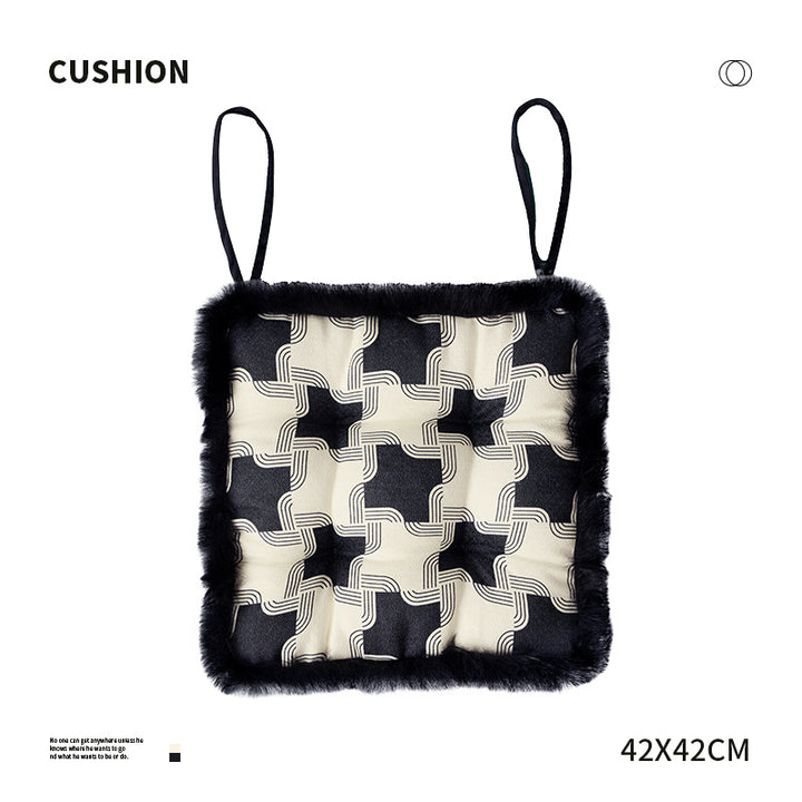 Padded seat cushion with fastening straps, quilted tufting surface and faux fur trim