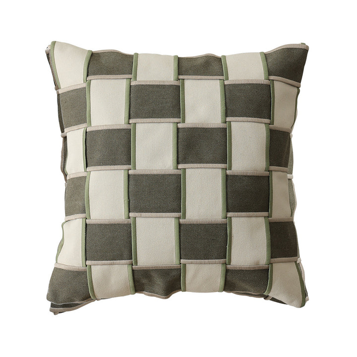 Decorative cushion cover with woven grid relief and contrasting piping