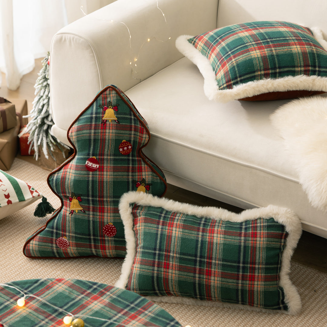 Christmas tree-shaped decorative pillow made of checked flannel with embroidered appliqués