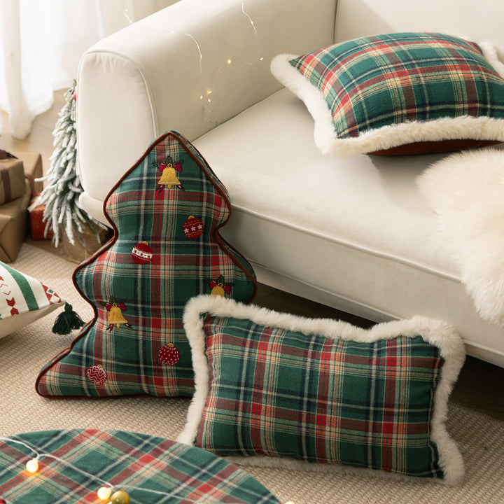 Christmas tree-shaped decorative pillow made of checked flannel with embroidered appliqués