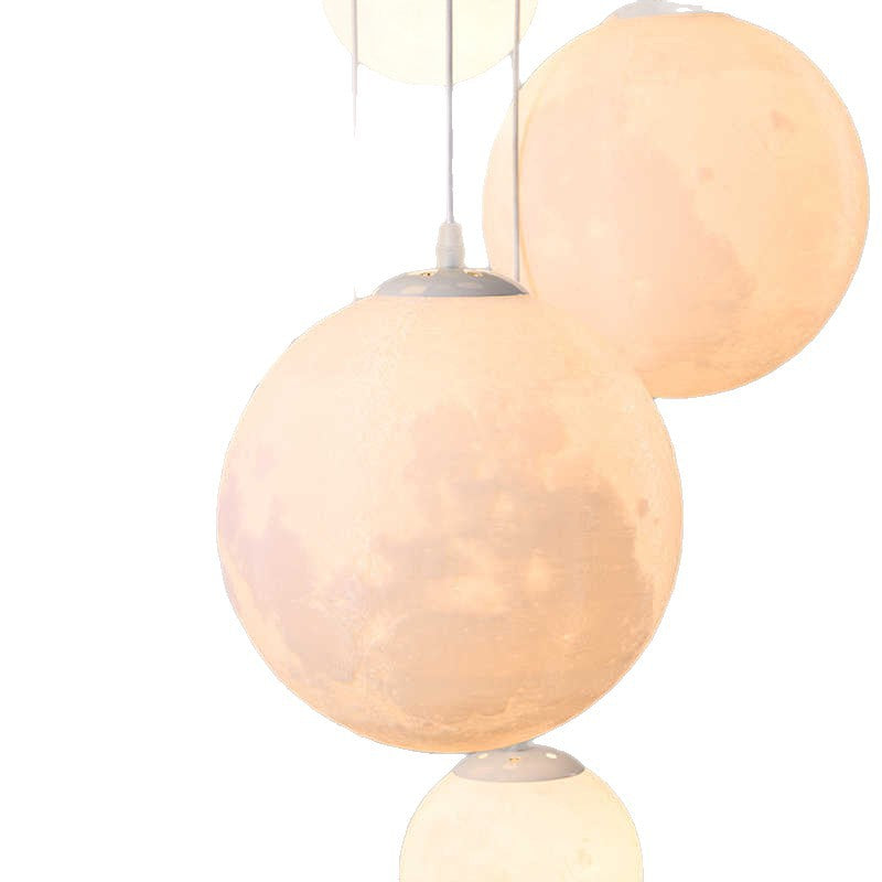 Cascading glass globe pendant lamp with wooden ceiling