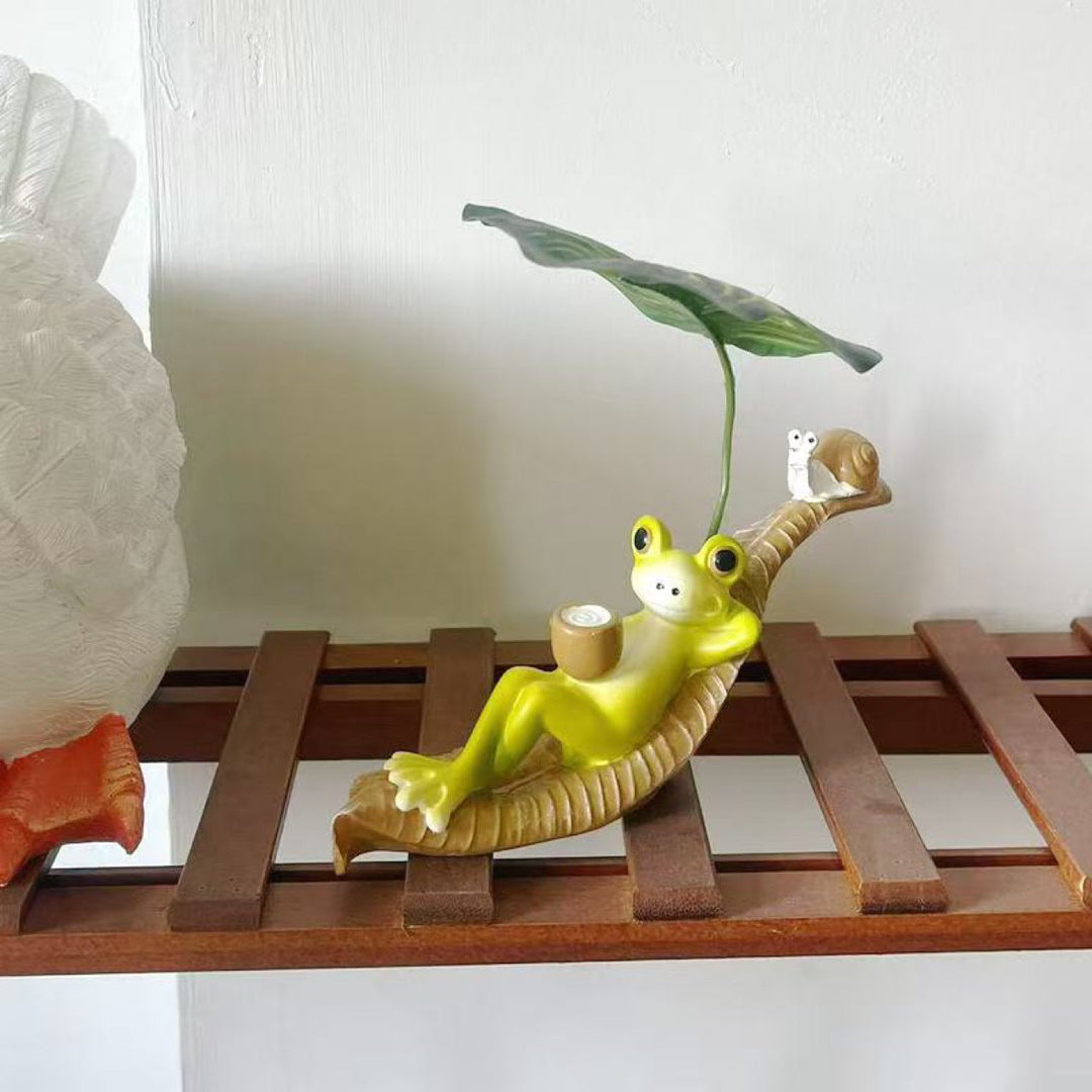 Funny frog figure with leaf decor