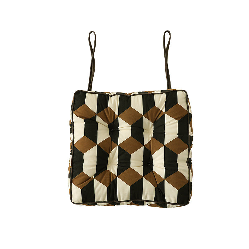 Padded chair cushion with ties and tufted seat