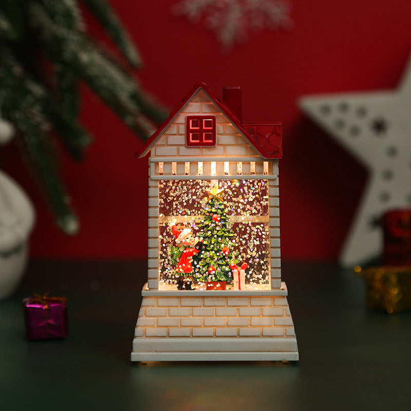 Illuminated Christmas village with moving figures
