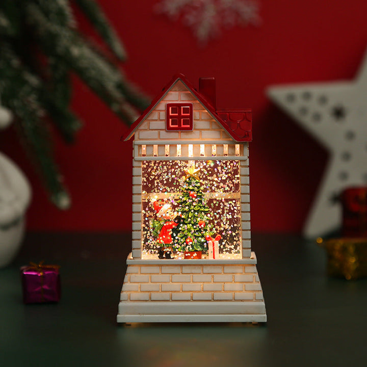 Illuminated Christmas village with moving figures