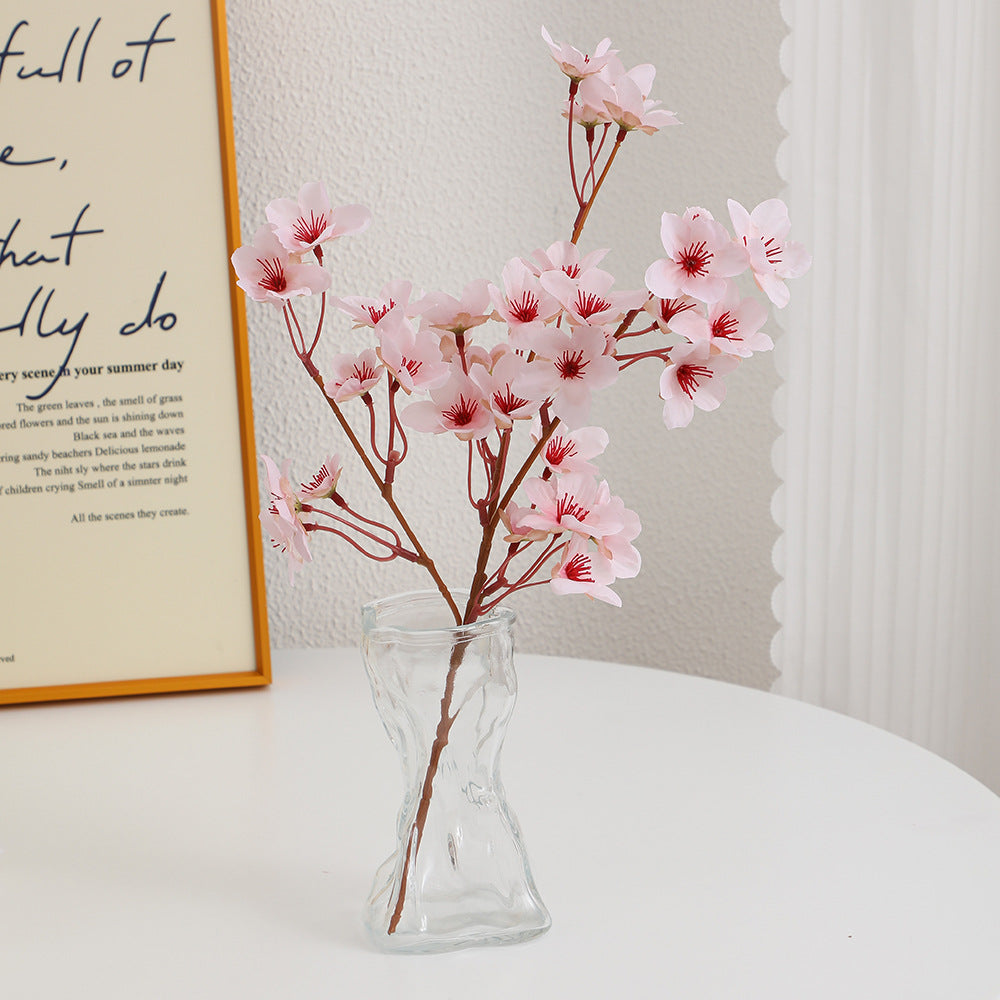 Artificial cherry blossom branch with detail-loving flowers