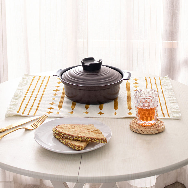 Woven placemat made of cotton blend with geometric diamond trim and fine texture