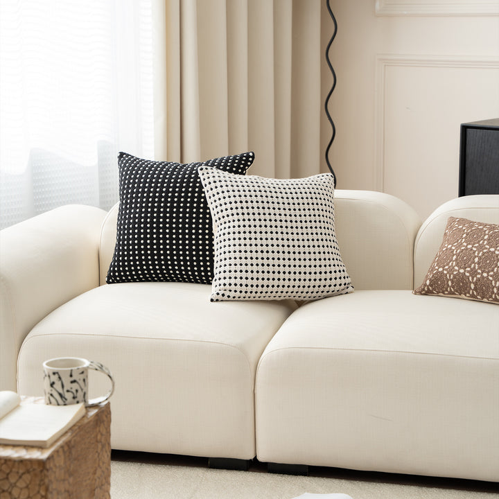 Woven decorative pillow with textured dot tufting