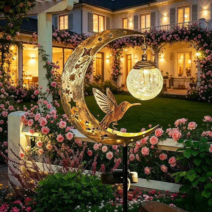 Solar-powered decorative garden stake light with crescent moon fairy lantern